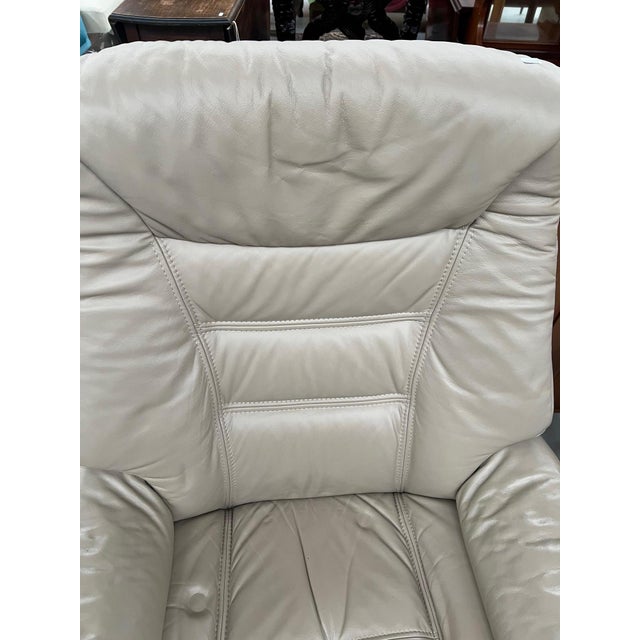 Set of Beige Leather Swivel Recliner Chair and Ottoman from Stressless, 2000s, in Very Good conditions. Designed from 2000...
