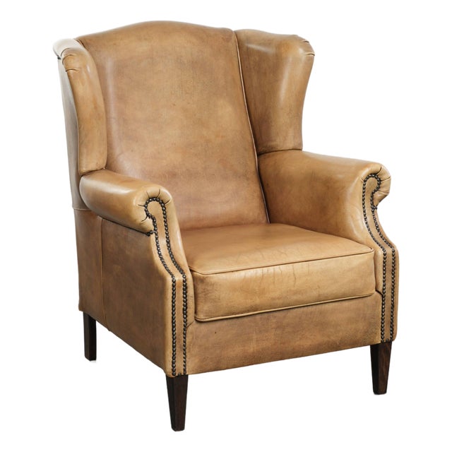 Light Cowhide Wing Armchair with a Timeless English Look and Good Seating Comfort For Sale