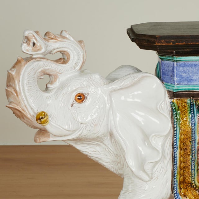 Standout vintage Italian elephant drinks stand crafted in terra cotta, hand decorated and glazed, sporting a fancy saddle...