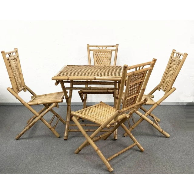 Beautiful midcentury set, made of bamboo and rattan foldable table and four chairs. It is an Italian production of 1960s...