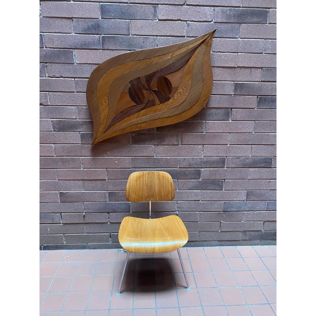 This striking one-of-a-kind MCM wood wall hanging is a unique piece of art, featuring an abstract leaf-like form with...