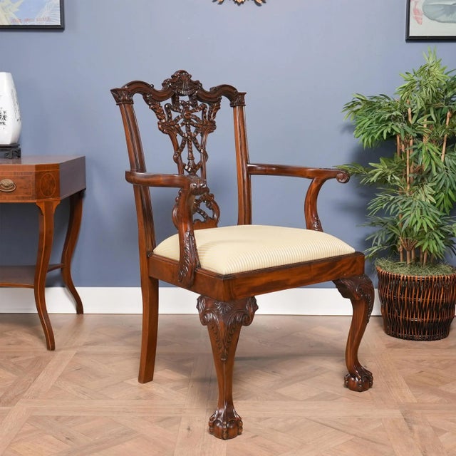 This set of ten Carved Mahogany Chippendale Dining Chairs by Niagara Furniture are also often referred to as ribbon back...