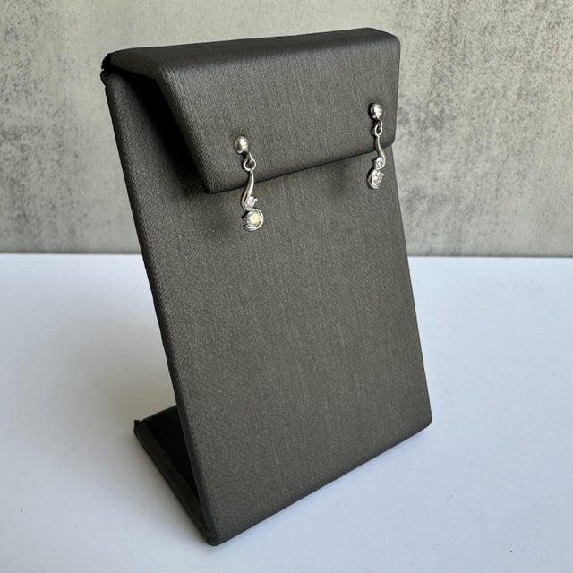 Elevate your jewelry collection with these stunning Platinum Diamond Dangle Earrings, featuring a total of 0.24 carats of...