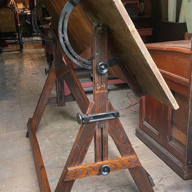 Stunning massive Keuffel & Esser (1867-1980) drafting table, which can be dropped all the way down and laid flat to 34” to...