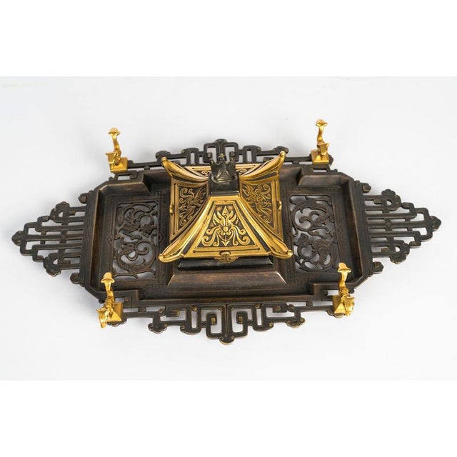 Patinated and gilded bronze inkstand from the Napoleon III period, 19th century, in Japanese style. Japanese-style...