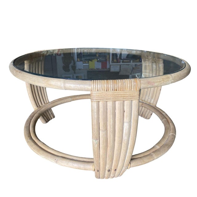 This beautifully restored Mid-century Five-strand rattan 2-coffee table The unusual round base's circular form is echoed...