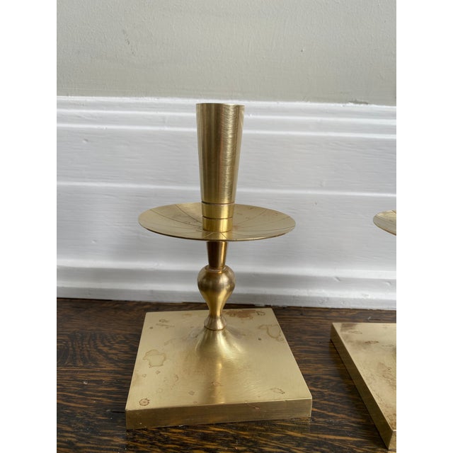 Mid Century Modern design by Tommi Parzinger. Gorgeous solid brass candle holders.