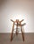 Sculptural Marbella bar stool , featuring the characteristic curved saddle seat with integrated handles and elegant...