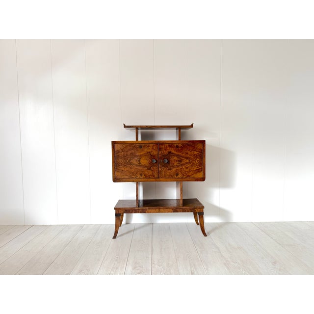 Unique walnut burl sideboard with brass details produced by Domus Nova in the 1930s. The Domus Nova furniture line,...