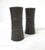 A pair of Dansk salt and pepper shakers from their Flamestone collection having ribbed designs and a mat finish to the...