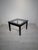 A unique coffee table with a timeless, elegant design, crafted from solid wood and finished in deep black. This piece...