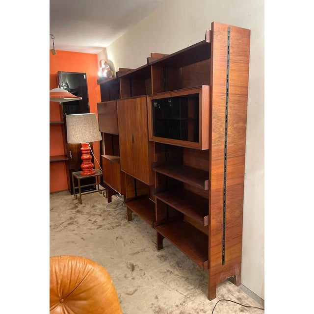 Mid-Century Modern wall unit by Vittorio Dassi, Italy, 1960s. This piece is attributed to the mentioned designer/maker. It...