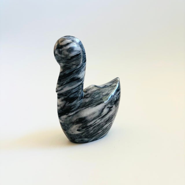 A vintage carved onyx stone pelican. Nice simplified modernist shape. Dramatic natural veining in gray and black. Original...