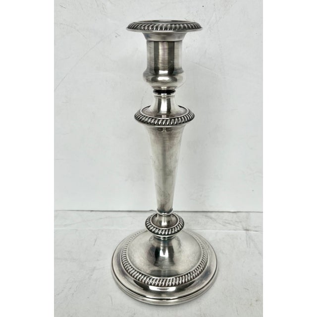 Made in England. Barker Ellis silver candle holder. Banded scroll design. Signed on the side of the base with the makers...