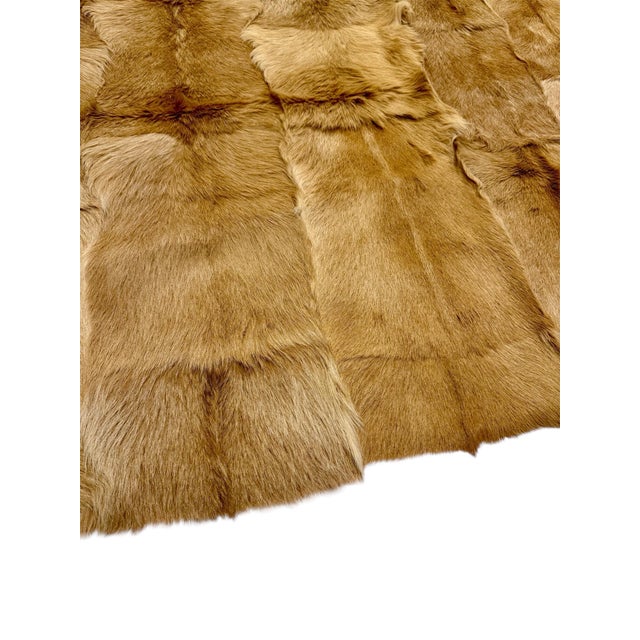 Luxurious Red Fox fur blanket sourced from Holly Hunt, Chicago. An heirloom piece, lined with a printed burgundy silk...