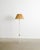 A rare and iconic Finnish mid century "30-058" floor lamp in white lacquered metal with a decorative and well matching...