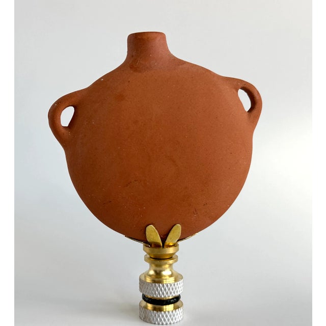 Lamp finial crafted from a replica canteen in the style of Native American pottery from New Mexico. Sized to fit a...