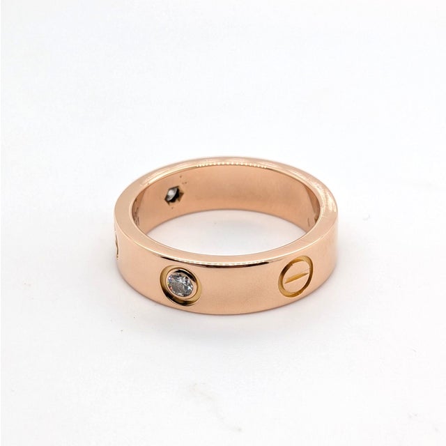 Contemporary Cartier "Love" Ring With Three Diamonds in 18k Rose Gold - Size 7.5 For Sale - Image 3 of 8