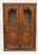 This piece is a classic French Provincial Louis XV style double-door armoire or display cabinet, showcasing characteristic...