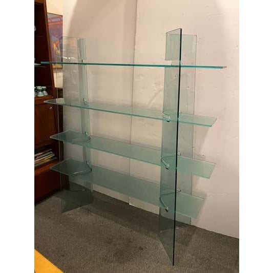 Tempered Glass Shelf. 4 glass shelves fit into the curved column cut-outs. Very solid design that sits very well! Columns...