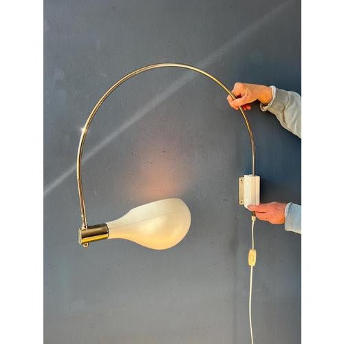 Very rare beige arc wall lamp by temde leuchten. The shade can be turned in any direction desirable and positioned inside...