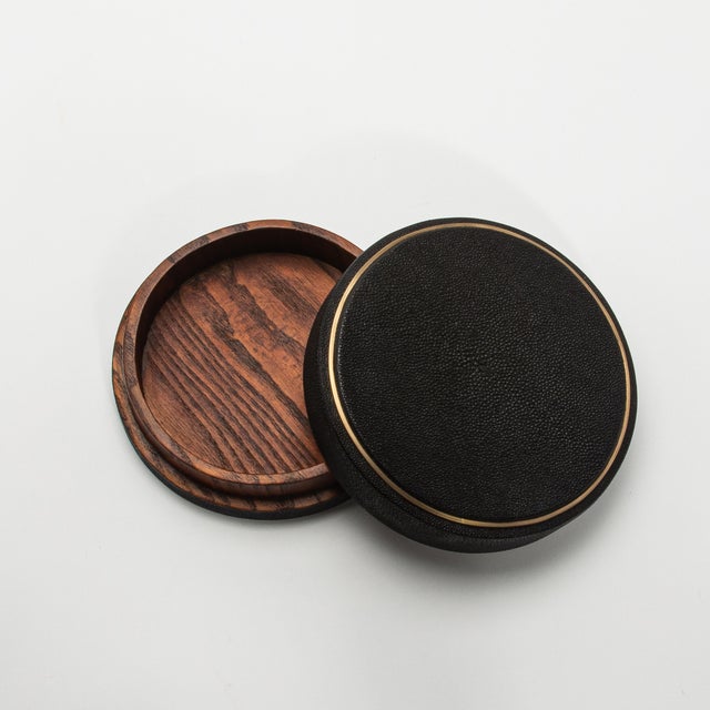 This set of 3 round boxes in black shagreen by R&Y Augousti showcases a design that seamlessly marries form and function....