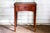 Restored heirloom Sewing Table of cherry-wood legs and walnut veneers. Surface folds out, doubling the useful area 16.5"D...