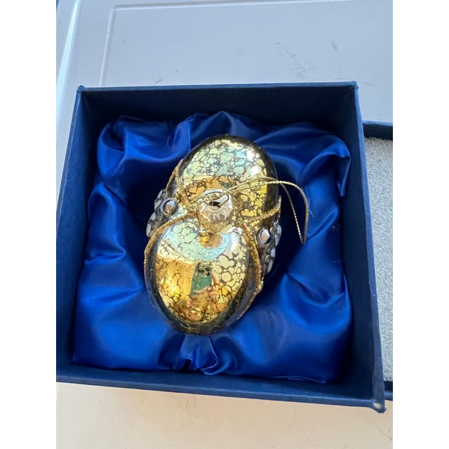 Sorelle Hand Crafted Glass Heart Ornament. Glitter and Metal Accents with original box. This heart-shaped ornament is...