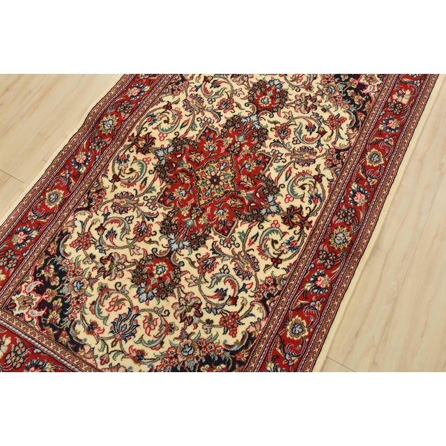 An authentic vintage traditional Qom rug, hand-knotted with fine wool and silk highlights, using natural dyes. This...