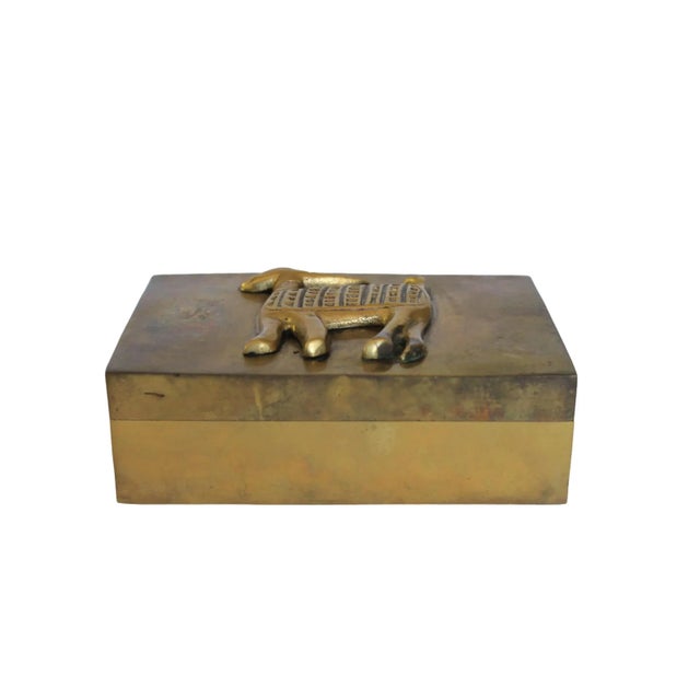 Vintage brass trinket box with African gazelle figure and red velvet lining inside box. No makers mark. Patina.