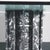 A stunning sculptural black marble table base with graffiti like effect and a beveled octagonal glass top. A true work of...