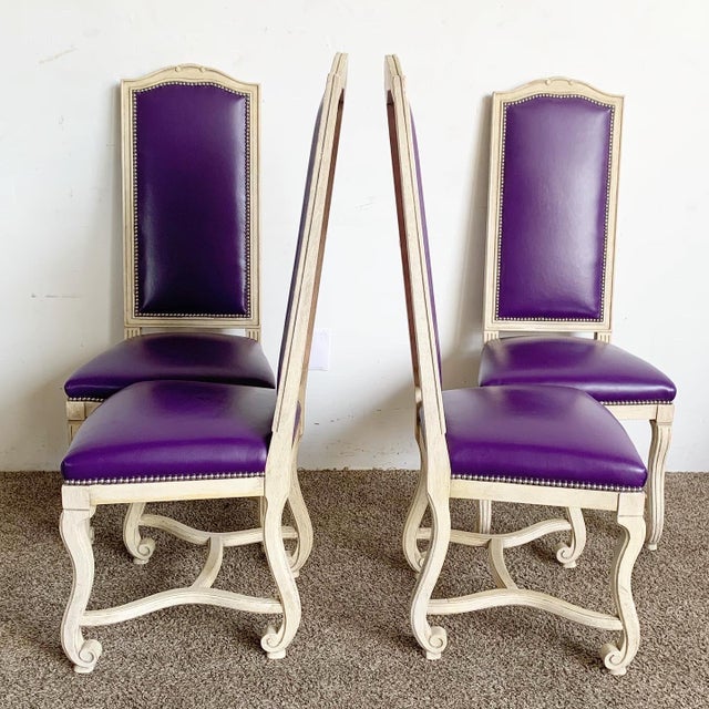 Introducing a set of 4 French Provincial Purple Vinyl and Platted Back Dining Chairs that exude a blend of classic...