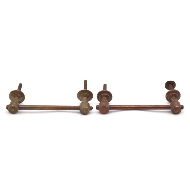 Vintage Traditional style bridge drawer or cabinet pulls made of brass with a dark patina finish. Only one original nut is...