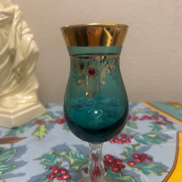 Elevate your home bar with this exquisite piece of Italian-inspired artistry. This hand-blown cordial glass features a...