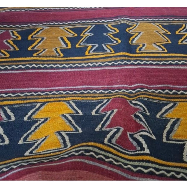Bring timeless artisan character into your home with this exceptional vintage kilim runner, expertly hand-woven in the...