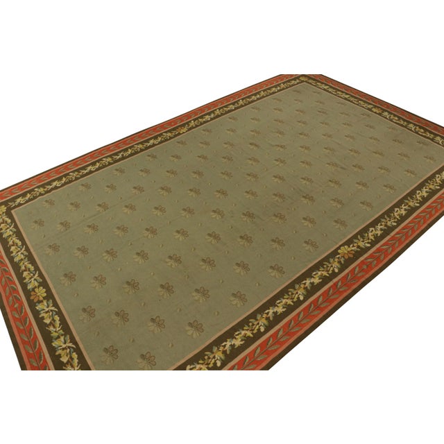 Handmade in wool circa 1920-1930, this 11x18 rug is a rare antique Arraiolos needlepoint from the titular region of...