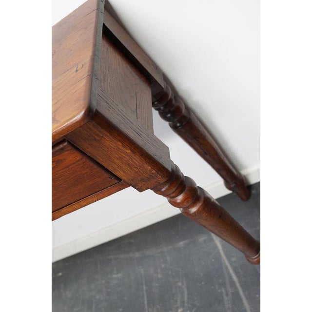 This Victorian side table was made from an antique dining table. It features two drawers and has a nice warm colour. The...