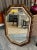 Venetian style 8 sided gilt wood wall mirror, accented with smaller clear and gold vein mirror panels. A wonderfully...