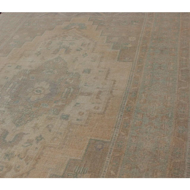 Textile Faded Turkish Hand Knotted Oushak With Medallion With Muted Colors of Tan, Muted Light Peach For Sale - Image 7 of 13