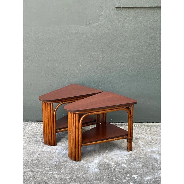 This vintage pair of side tables is cut into a wedge, or pie-slice, form, with a softly rounded triangular top and a...