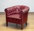 A characterful and elegant Swedish Chesterfield armchair dating from the 1930s, executed in rich red-brown leather. This...