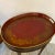 An Antique hand painted 19th Century Italian tole tray with custom mahogany base. The oval tray is 19 inches by 15 inches...