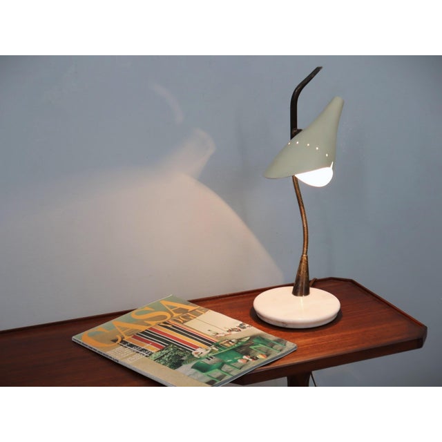 Rare and elegant table lamp designed by oscar torlasco for lumen in the 1950s, a remarkable example of post-war italian...