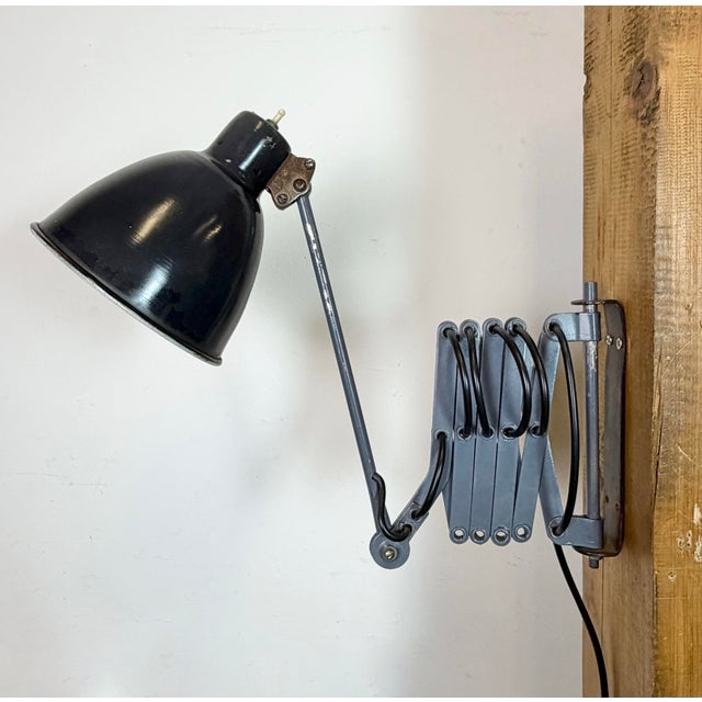 This vintage industrial grey scissor wall light was made in Ukraine in former Soviet Union during the 1960s. It features a...
