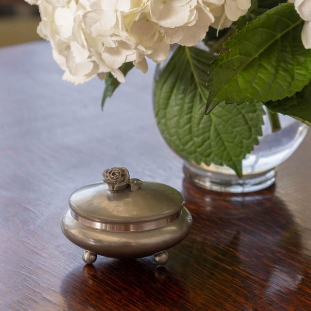 Beautiful pewter decorative bowl from France, 1930s. Stunning bowl with flower handle and lid resting on three ball feet....