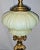 French 19c oil lamp electrified to accept a fabric shade, dore' bronze base, green uranium vaseline glass oil tank....