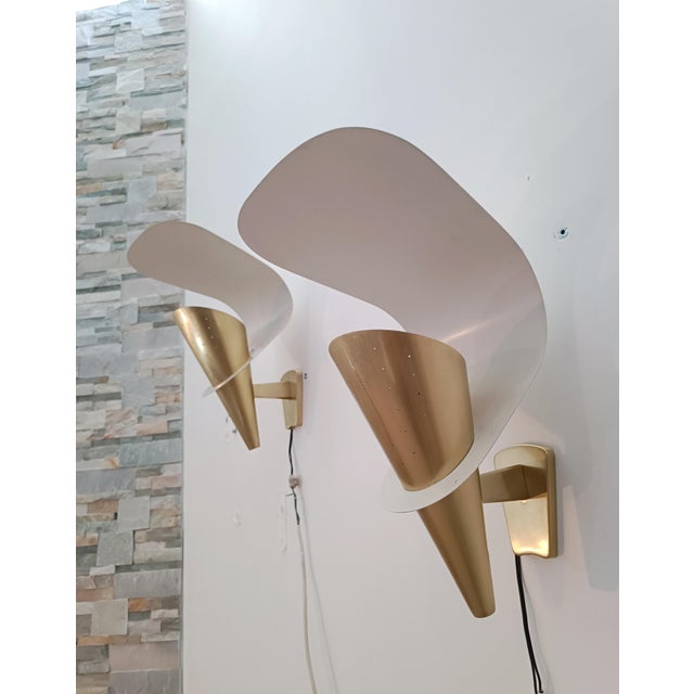 Spectacular and very rare pair of Metalarte wall sconces. Made in Spain between 1958 and 1964. The original yellow and...