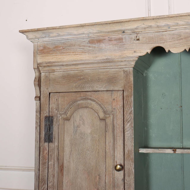 Late 18th century English bleached oak dresser with a wonderful aged oak finish. 1770. Internal depth of cupboard shelves:...