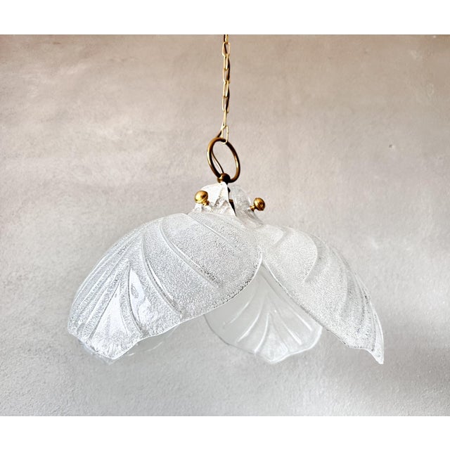 Elegant vintage pendant lamp with a unique floral design, featuring four Murano glass shades. This lamp adds a touch of...