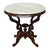 An antique Eastlake style carved walnut table, dating to approximately 1890. This elegant table features an oval white...